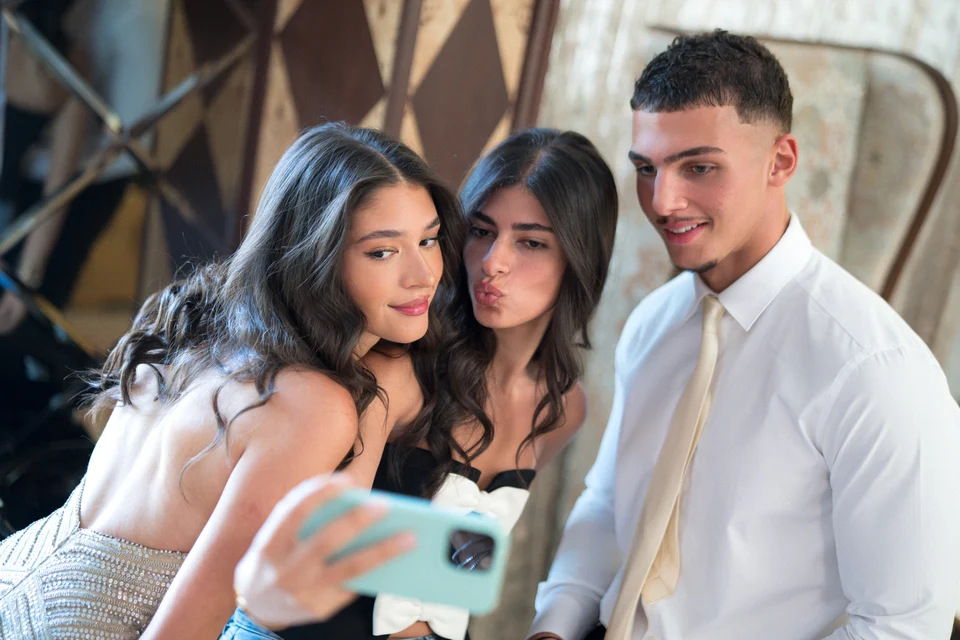 Three guests taking selfie