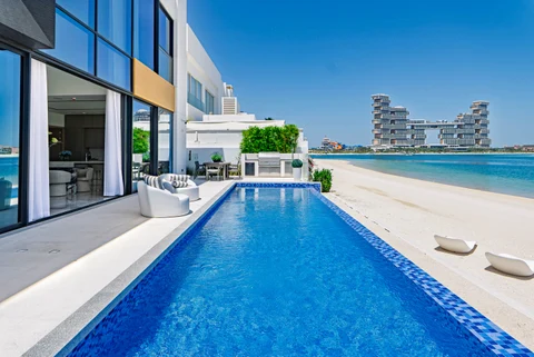Waterfront villa long blue pool