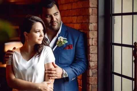Couple window light embrace